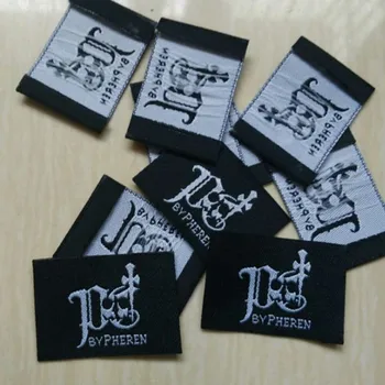 Наклейка из черной дамасской ткани с логотипом на конце 35 мм * 25 мм